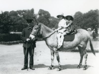 Two young girls riding an ass, London Zoo, August 1922 by Frederick William Bond